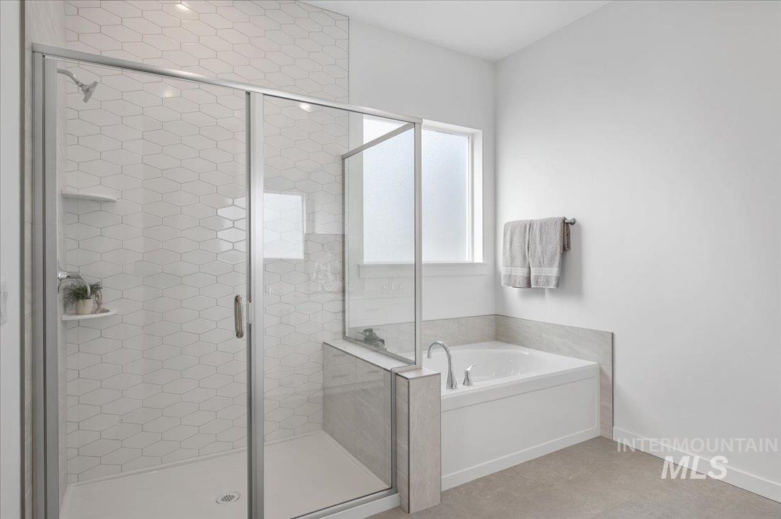 1120 West Switchgrass Drive Meridian, ID 83642 - Photo 10 of 13 Bathroom with a garden tub and a shower stall