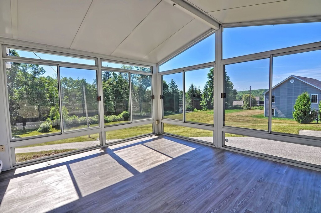 138 Leland Hill Road Sutton, MA 01590 - Photo 13 of 26 a view of a building with porch and wooden floor