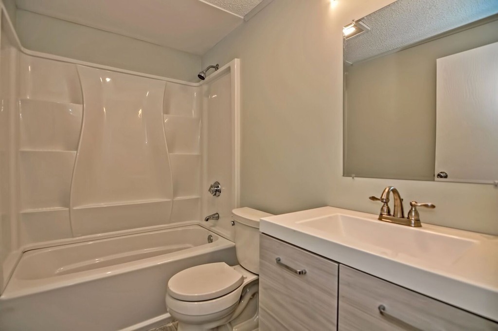 138 Leland Hill Road Sutton, MA 01590 - Photo 17 of 26 a bathroom with a sink a toilet and a bathtub