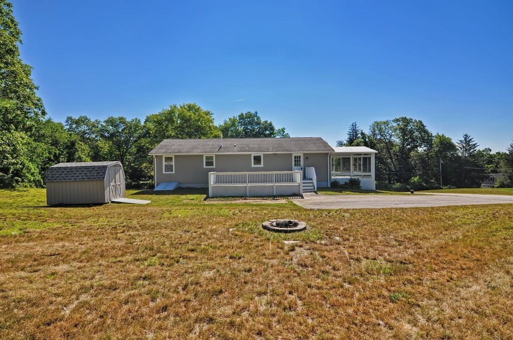 138 Leland Hill Road Sutton, MA 01590 - Photo 2 of 26 a house with swimming pool in front of it