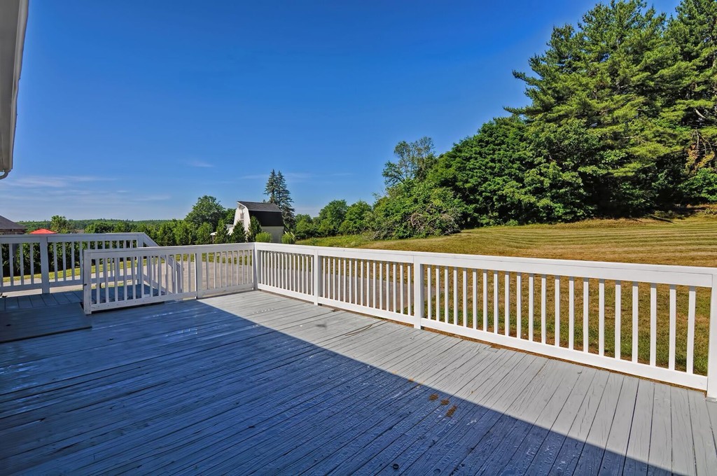 138 Leland Hill Road Sutton, MA 01590 - Photo 7 of 26 a view of deck with wooden floor and fence