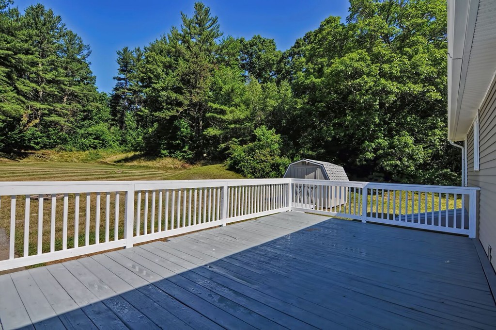 138 Leland Hill Road Sutton, MA 01590 - Photo 8 of 26 a view of a balcony with wooden floor