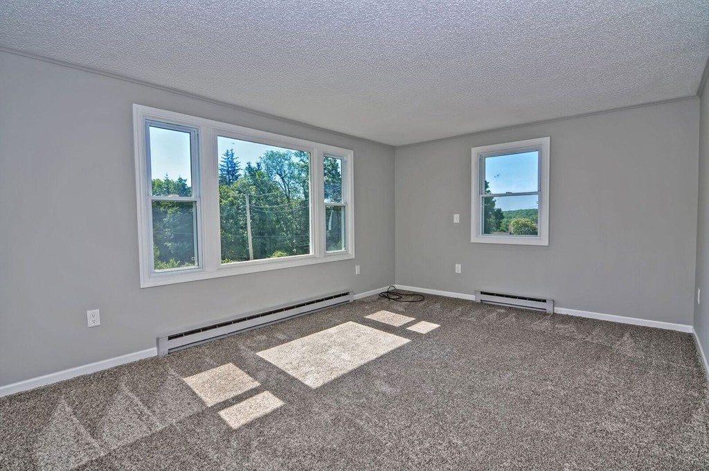 138 Leland Hill Road Sutton, MA 01590 - Photo 10 of 26 a view of an empty room with a window