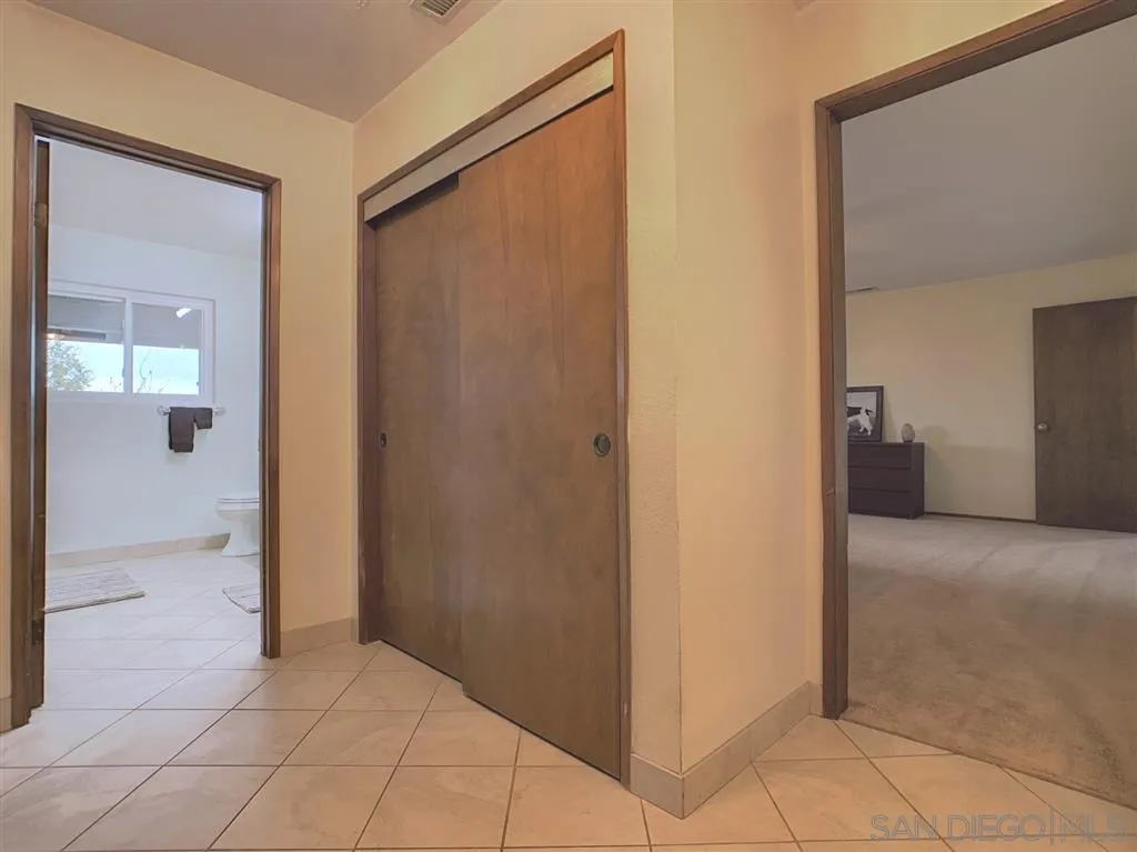 21152 Sutherland Dam Road Ramona, CA 92065 - Photo 11 of 25 a view of a bathroom from a hallway