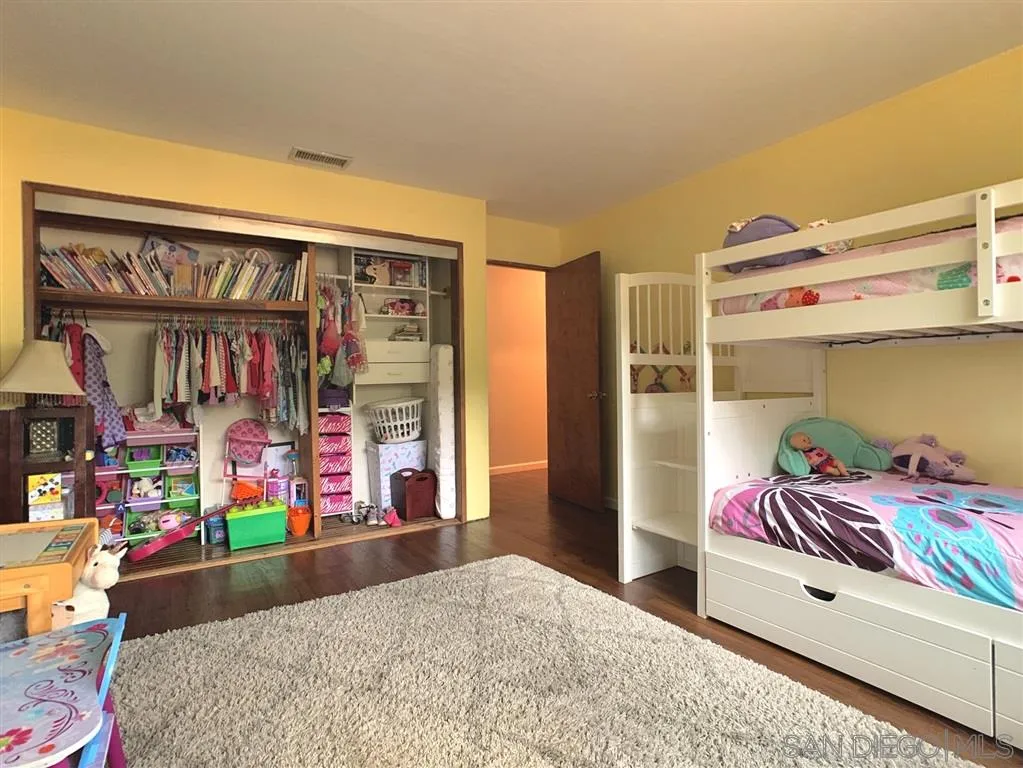 21152 Sutherland Dam Road Ramona, CA 92065 - Photo 16 of 25 a bedroom with bed and a window
