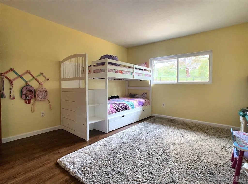 21152 Sutherland Dam Road Ramona, CA 92065 - Photo 17 of 25 a bed room with a bed
