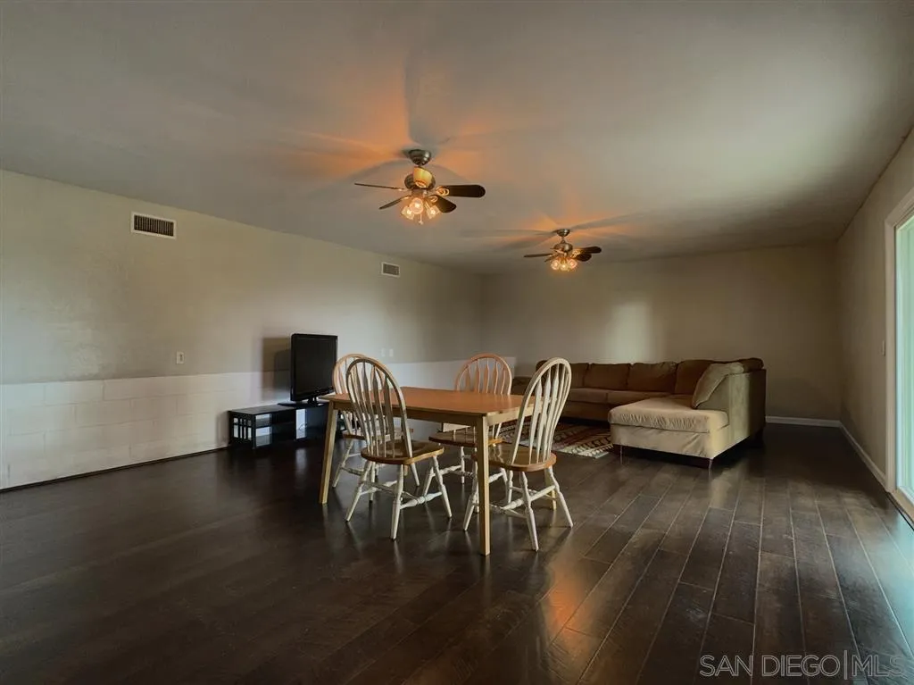 21152 Sutherland Dam Road Ramona, CA 92065 - Photo 21 of 25 a view of a dining room with furniture and wooden floor