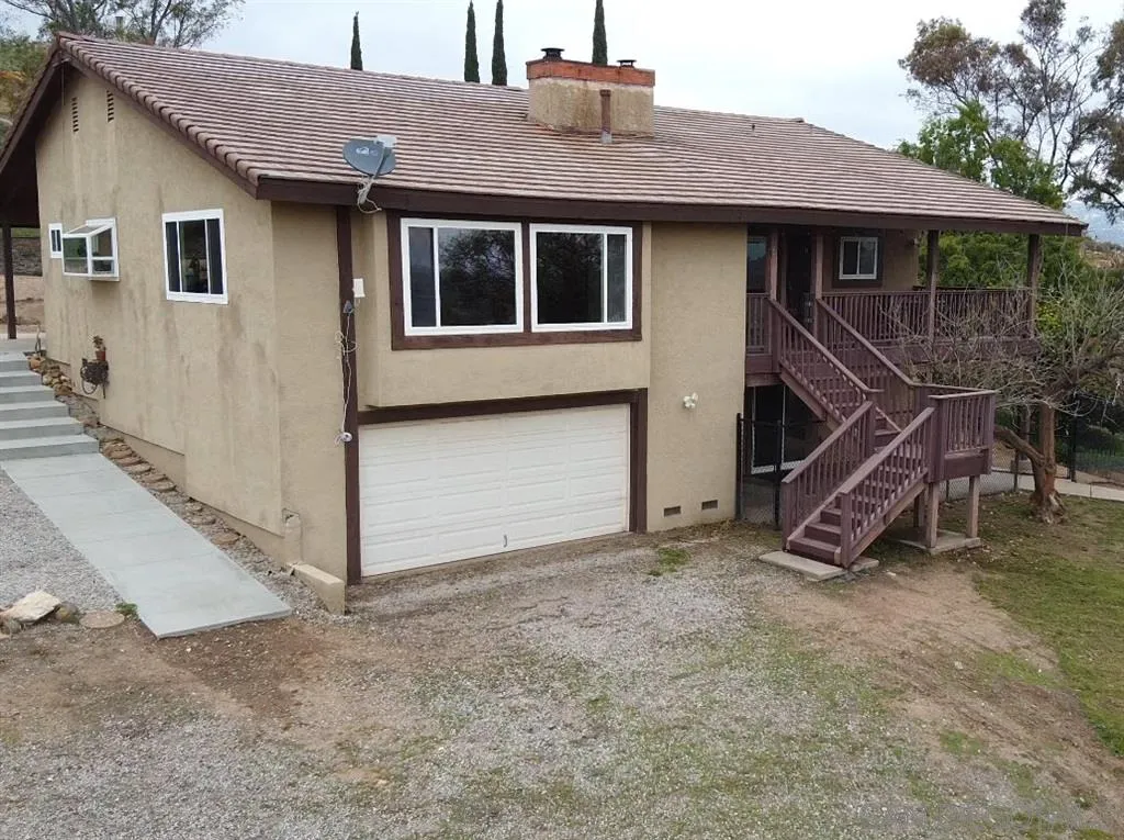 21152 Sutherland Dam Road Ramona, CA 92065 - Photo 3 of 25 a house view with a backyard space