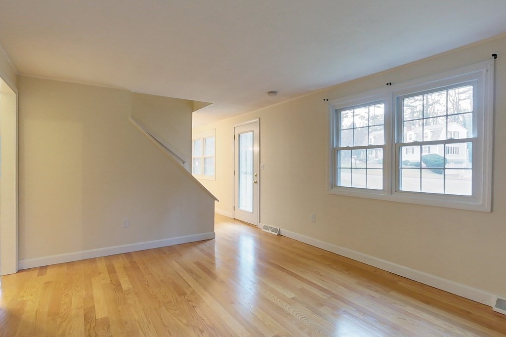 5 Peach Lane Townsend, MA 01469 - Photo 11 of 32 a view of an empty room with wooden floor and a window