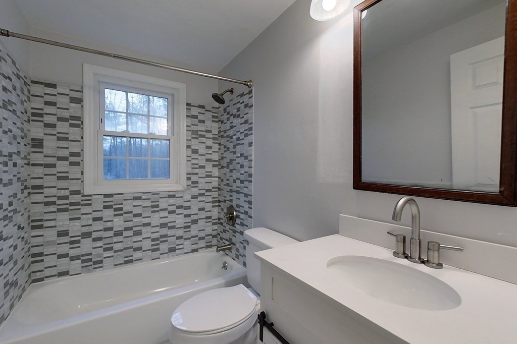 5 Peach Lane Townsend, MA 01469 - Photo 15 of 32 a bathroom with a toilet a sink and bathtub