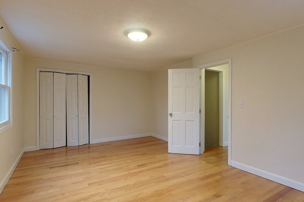 5 Peach Lane Townsend, MA 01469 - Photo 16 of 32 a view of an empty room and wooden floor
