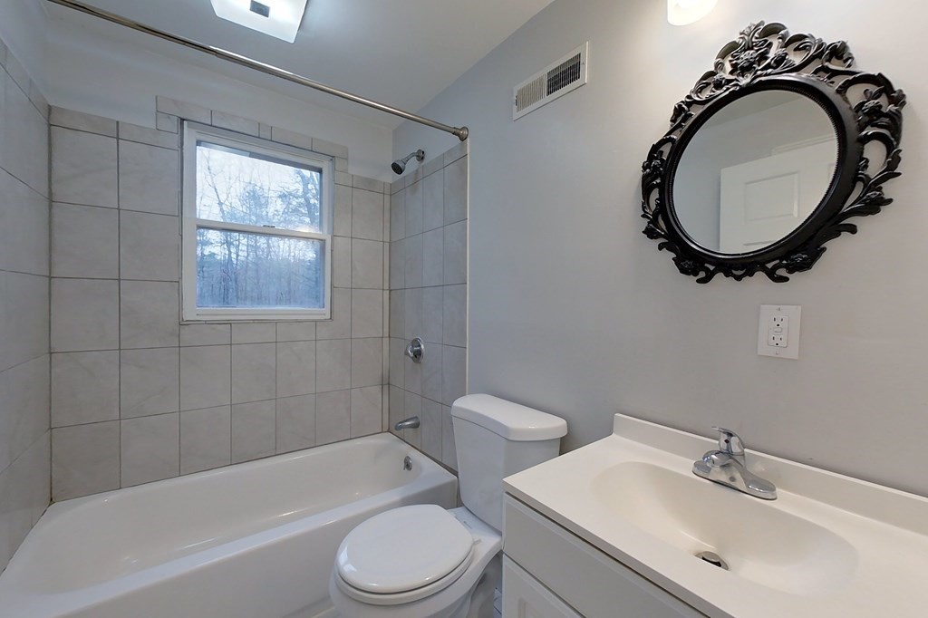 5 Peach Lane Townsend, MA 01469 - Photo 22 of 32 a bathroom with a sink a toilet and a mirror