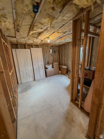 680 Timpie Road Tooele, UT 84074 - Photo 21 of 31 Unfinished interior space featuring exposed wood framing, ceiling insulation, and a concrete floor