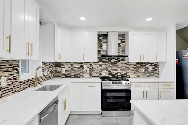 a kitchen with a sink stove and cabinets