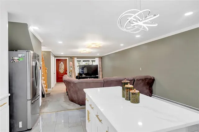 a kitchen with stainless steel appliances a refrigerator and a sink
