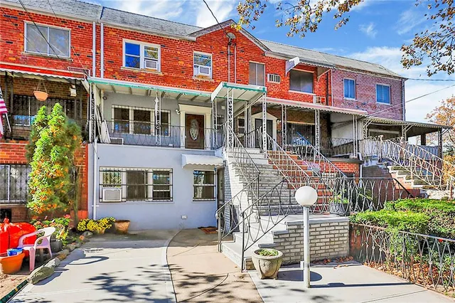 a front view of a brick building with many windows