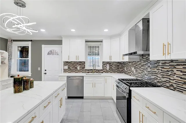 a kitchen with a sink stove and cabinets