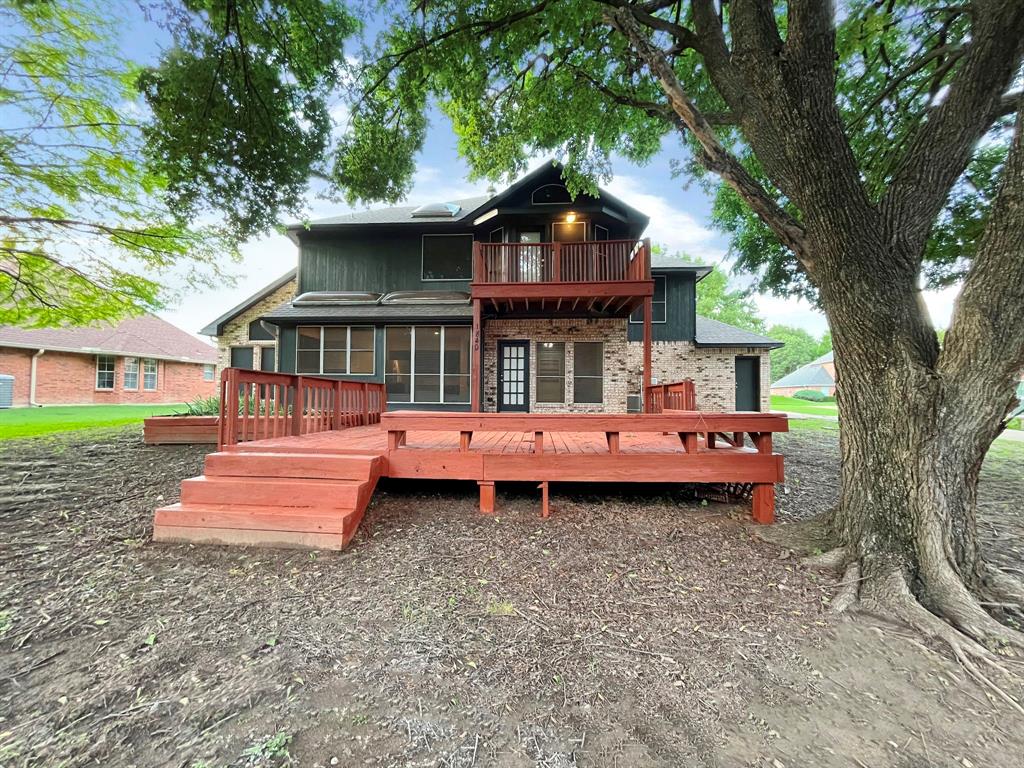 1840 Wind Hill Road Rockwall, TX 75087 - Photo 28 of 28 front view of a house with a yard