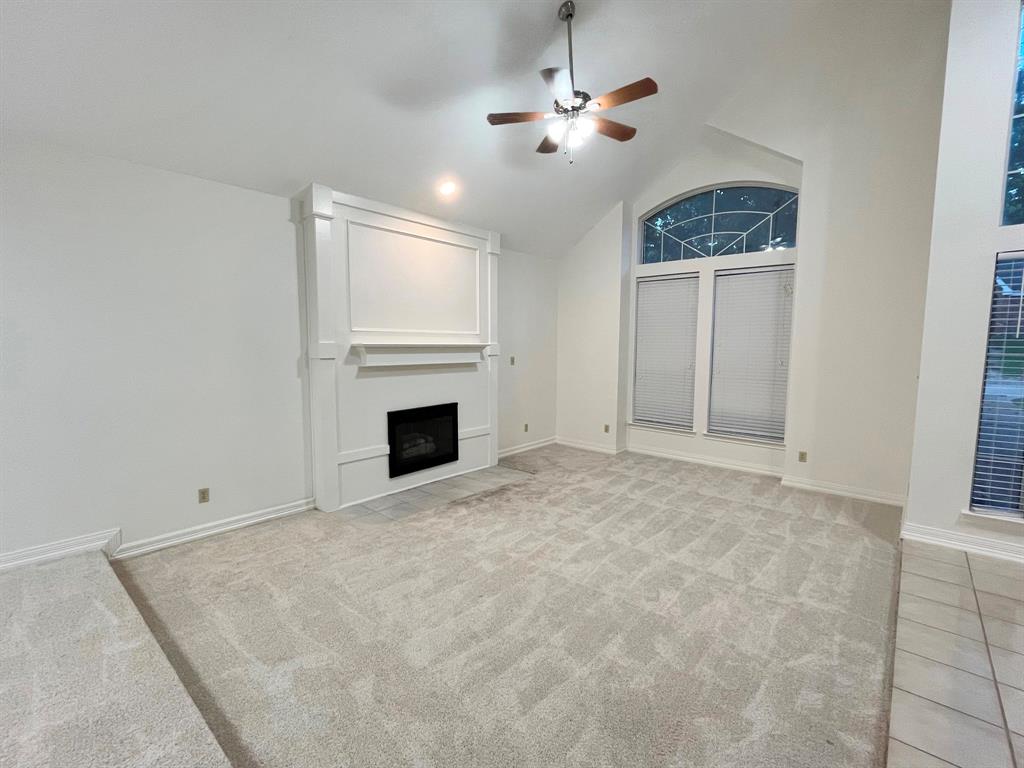 1840 Wind Hill Road Rockwall, TX 75087 - Photo 6 of 28 a view of empty room with a fireplace