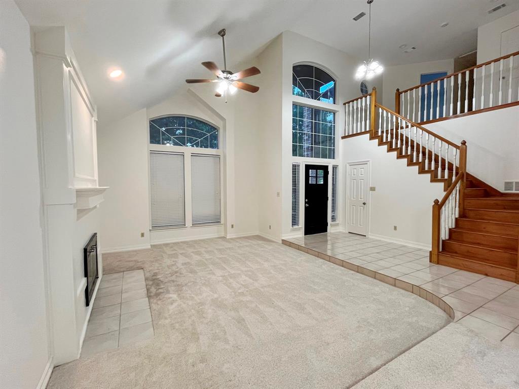 1840 Wind Hill Road Rockwall, TX 75087 - Photo 8 of 28 a view of livingroom and staircase with white walls