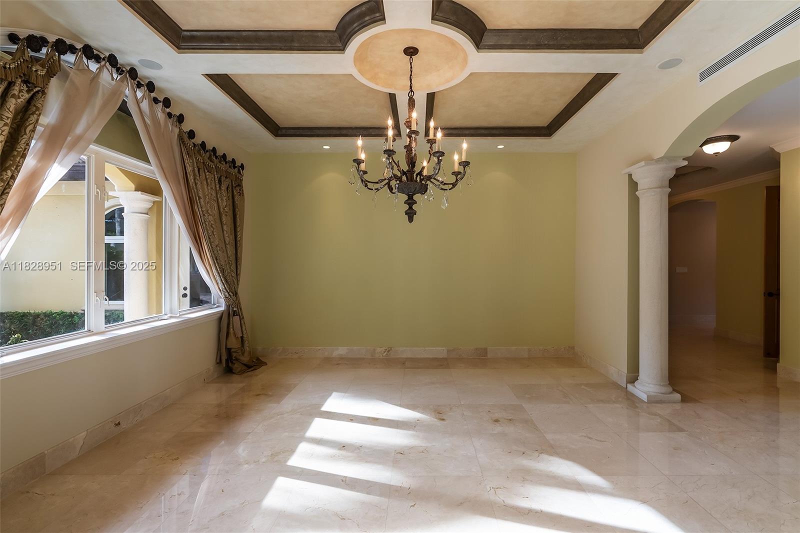 10851 Southwest 63rd Avenue Pinecrest, FL 33156 - Photo 12 of 63 a view of a hallway with chandelier and entryway