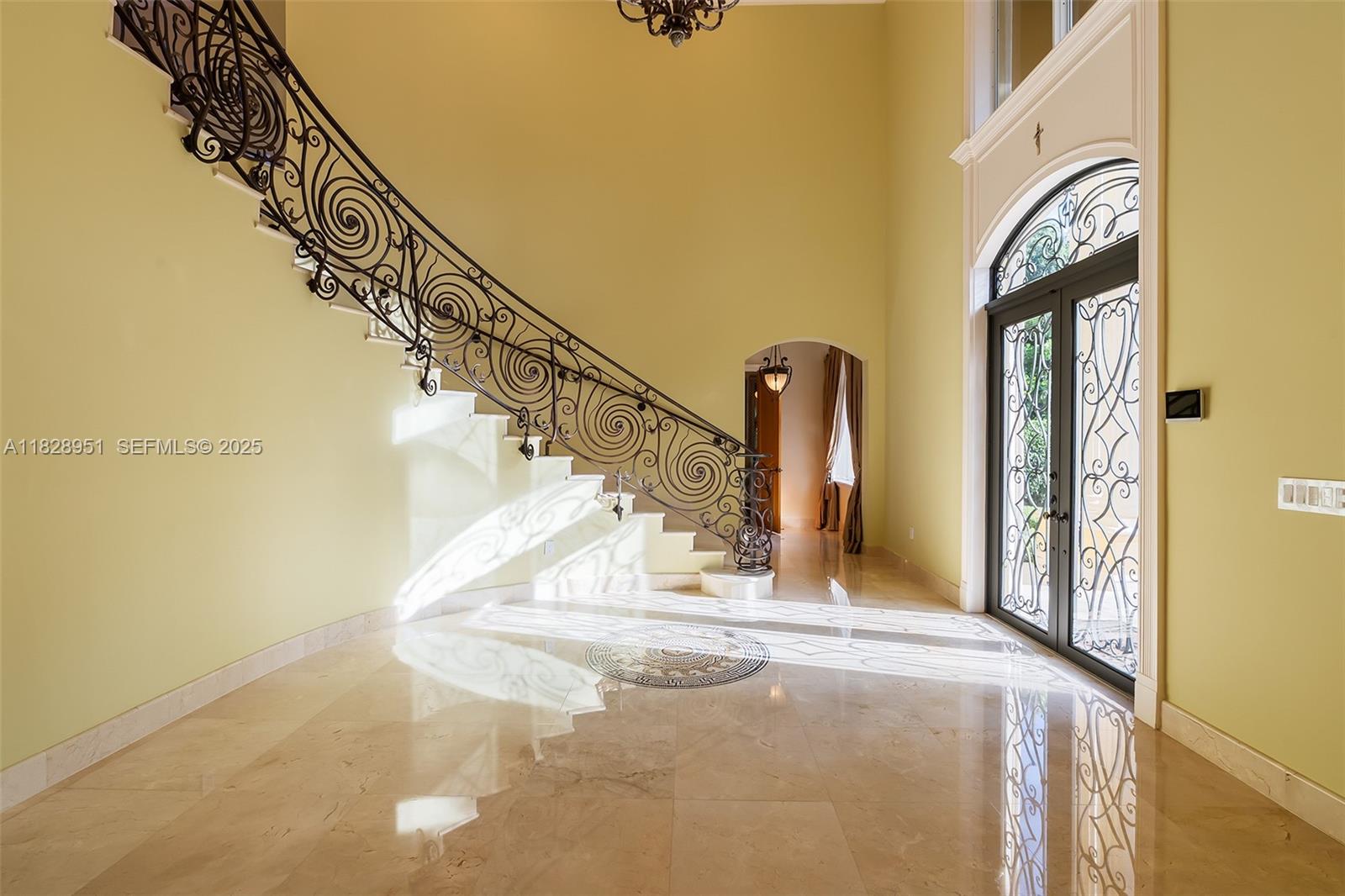 10851 Southwest 63rd Avenue Pinecrest, FL 33156 - Photo 14 of 63 a view of entryway and hall with wooden floor