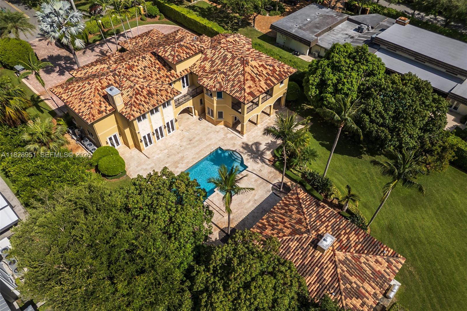 10851 Southwest 63rd Avenue Pinecrest, FL 33156 - Photo 30 of 63 an aerial view of residential house with parking and yard