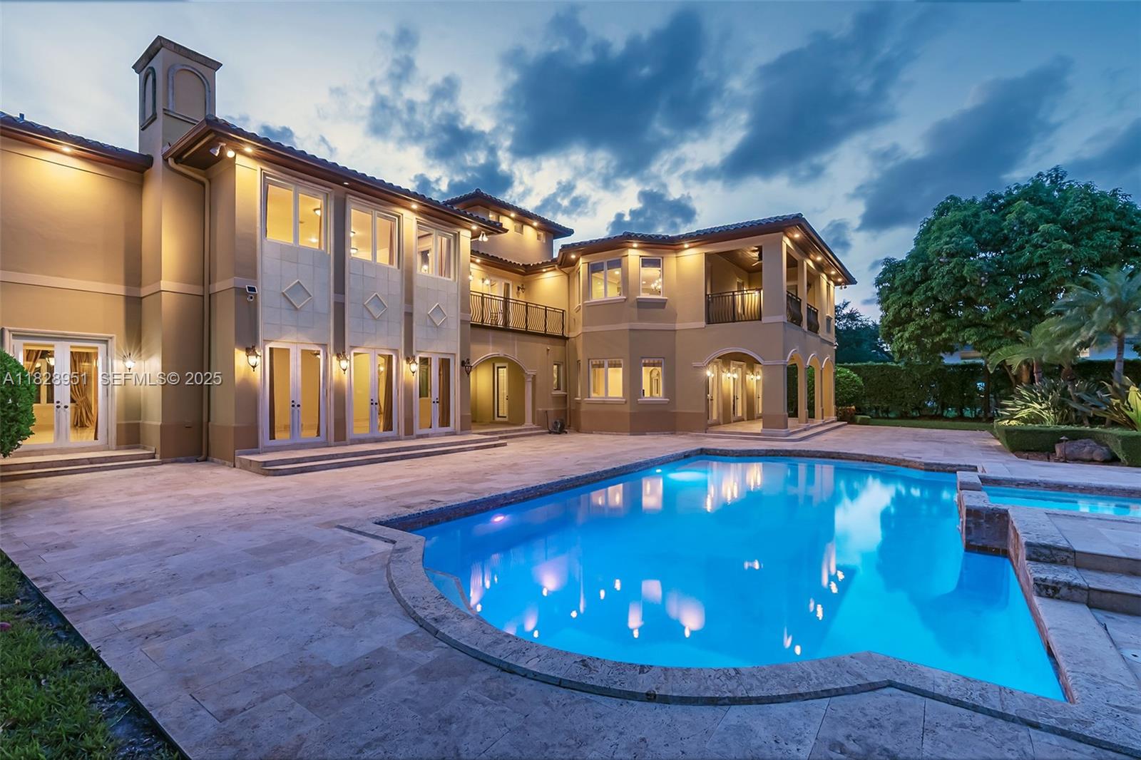10851 Southwest 63rd Avenue Pinecrest, FL 33156 - Photo 31 of 63 a front view of a house with swimming pool