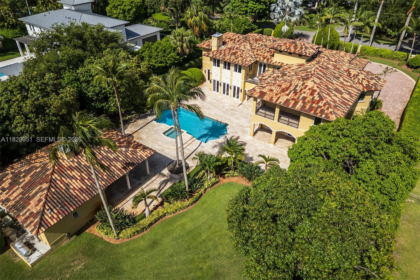 10851 Southwest 63rd Avenue Pinecrest, FL 33156 - Photo 32 of 63 an aerial view of a house with a yard