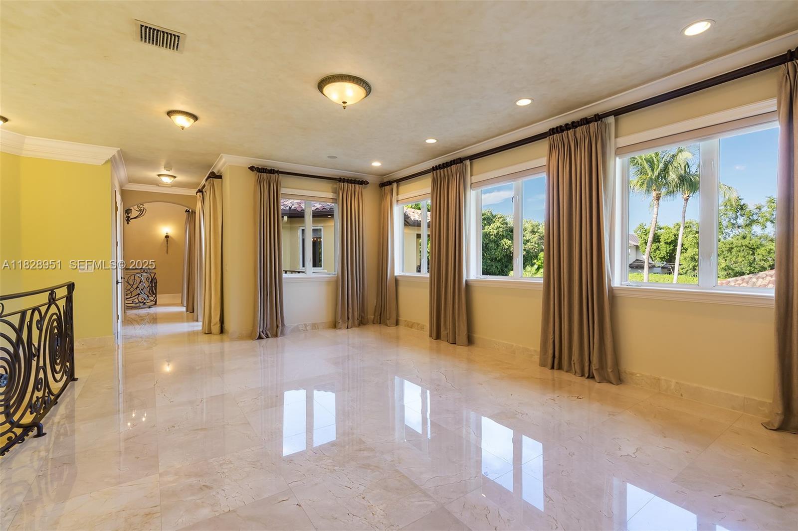 10851 Southwest 63rd Avenue Pinecrest, FL 33156 - Photo 42 of 63 a view of an empty room with a fireplace and a window