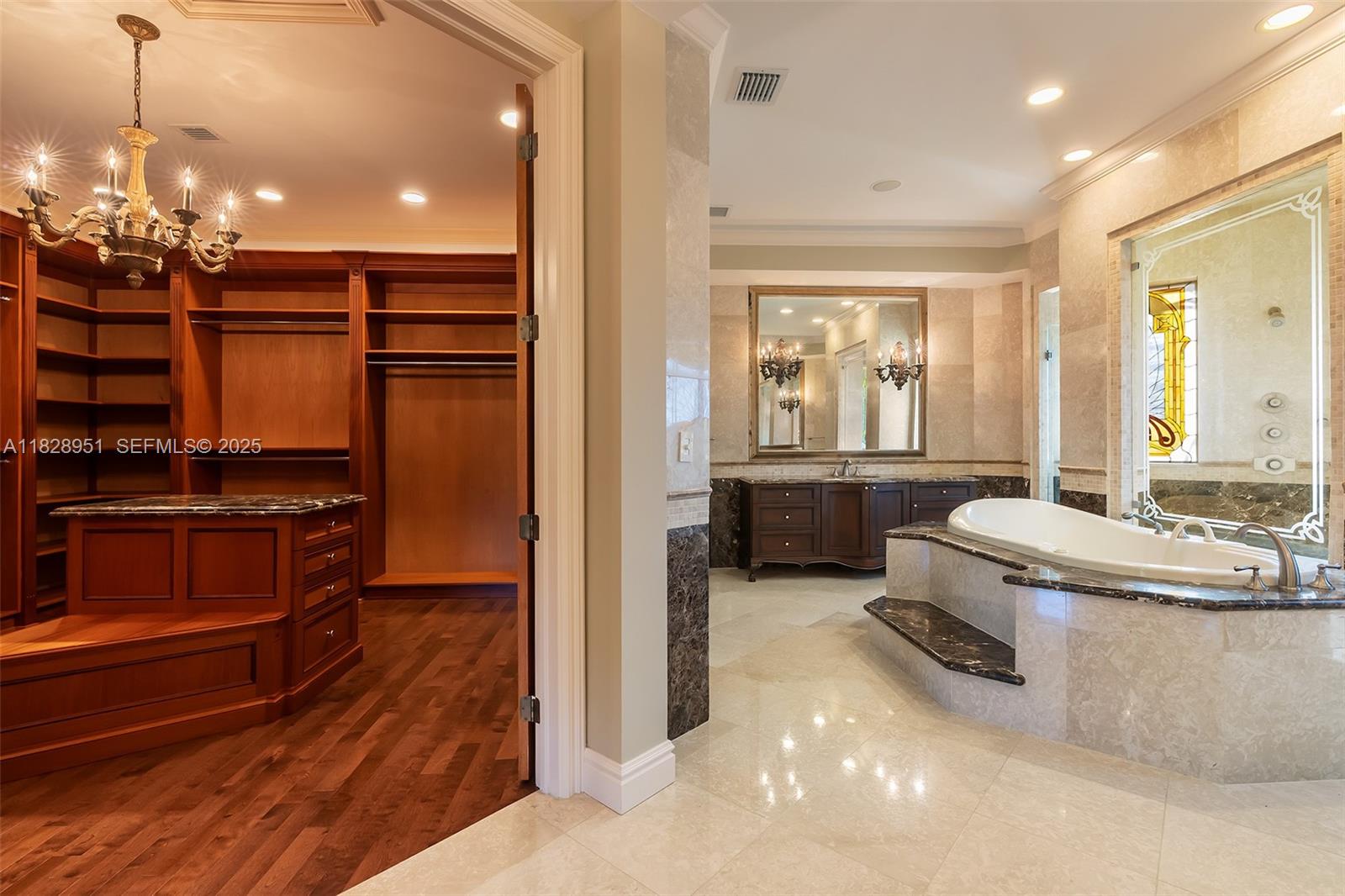 10851 Southwest 63rd Avenue Pinecrest, FL 33156 - Photo 47 of 63 a kitchen with kitchen island a stove a sink and a refrigerator