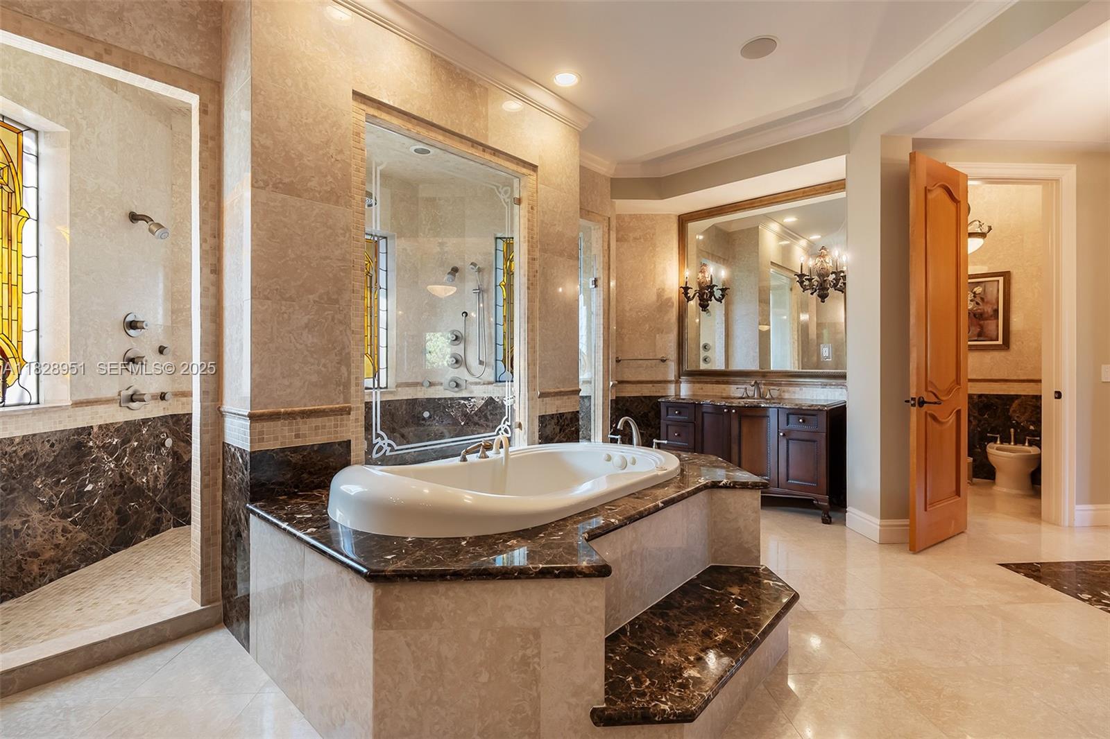 10851 Southwest 63rd Avenue Pinecrest, FL 33156 - Photo 50 of 63 a bathroom with a sink a toilet and shower