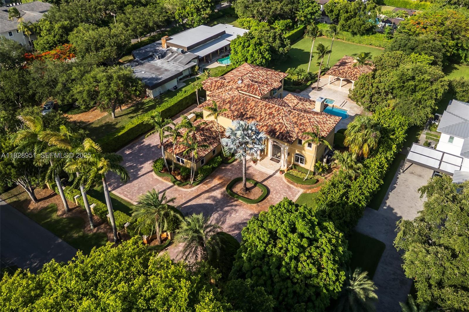 10851 Southwest 63rd Avenue Pinecrest, FL 33156 - Photo 9 of 63 an aerial view of a house with a yard