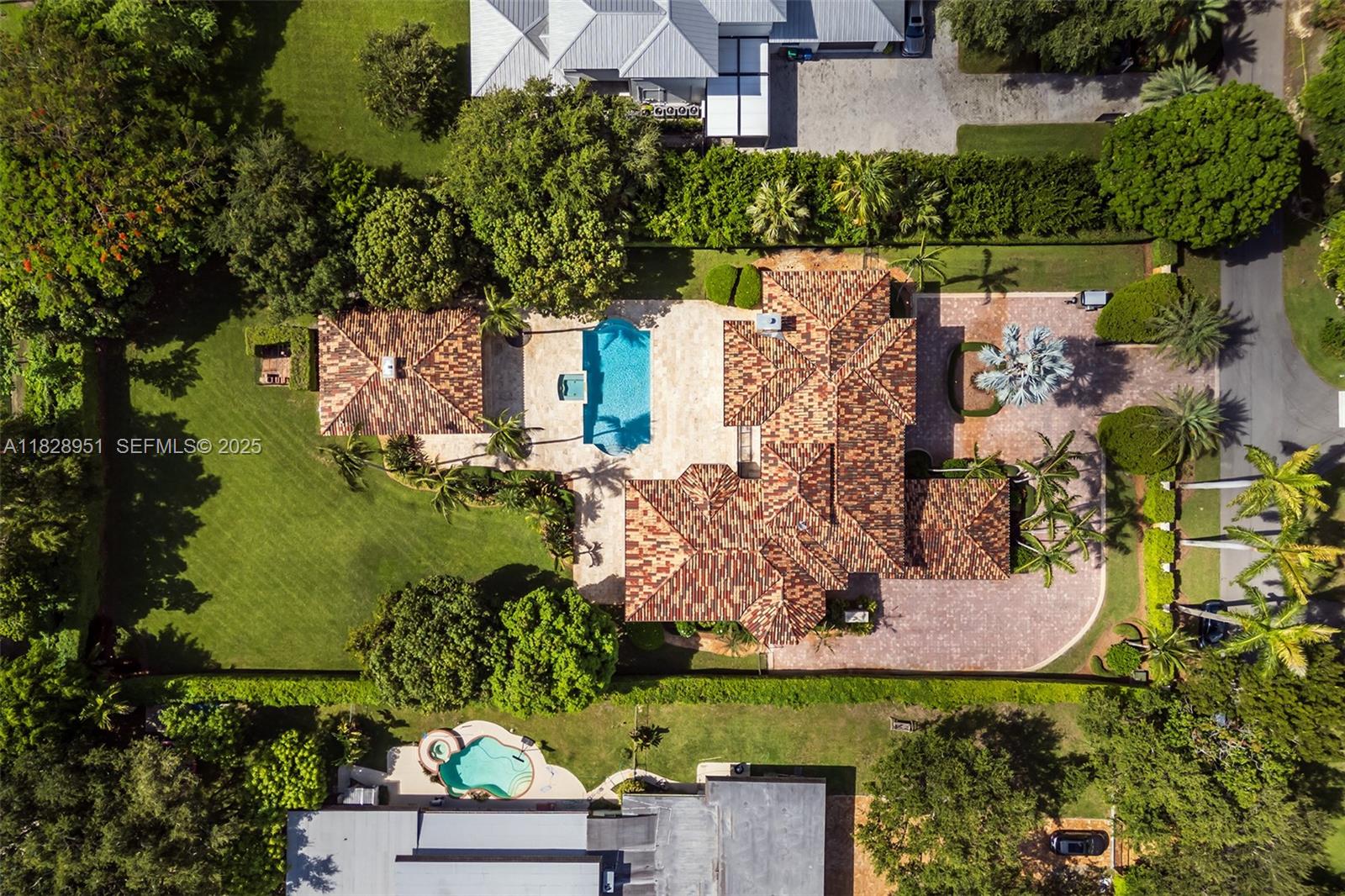 10851 Southwest 63rd Avenue Pinecrest, FL 33156 - Photo 10 of 63 an aerial view of a house with a garden and lake view