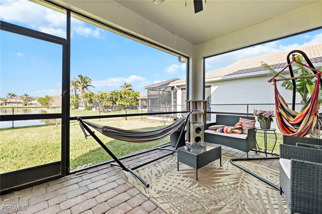 8657 Sumner Avenue Fort Myers, FL 33908 - Photo 10 of 29 a living room with furniture and a floor to ceiling window