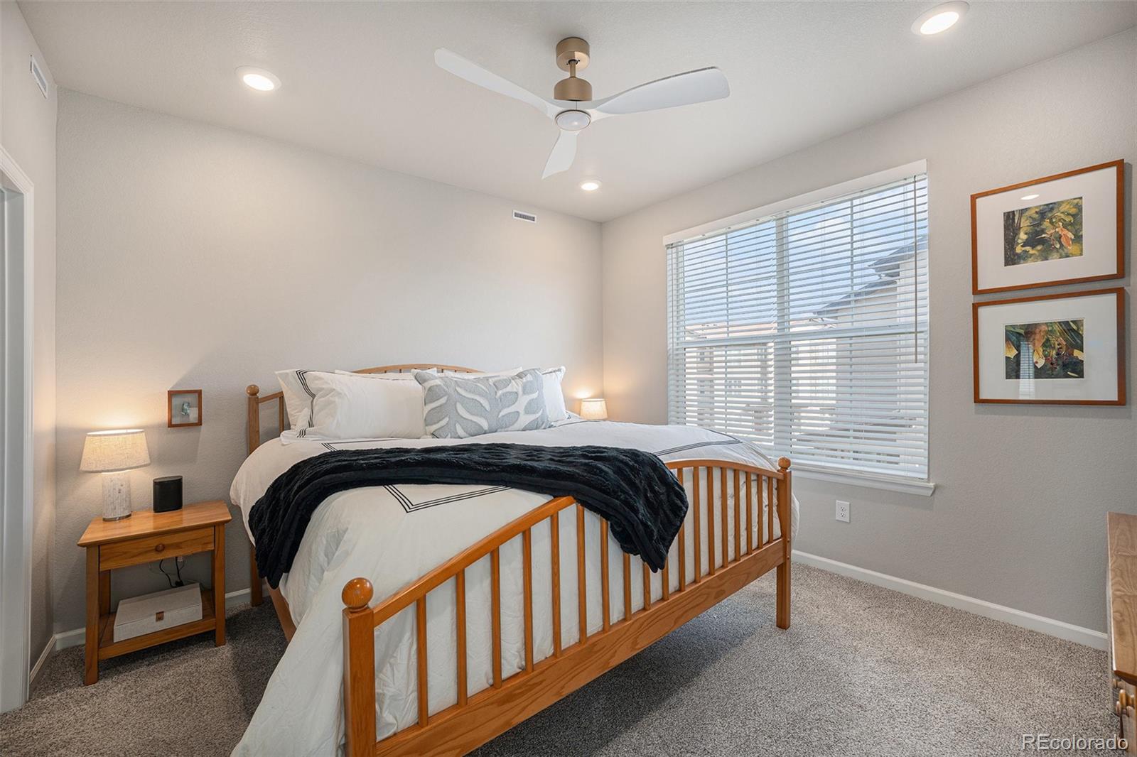 8430 Donati Terrace, Unit A Highlands Ranch, CO 80129 - Photo 12 of 26 a bedroom with a bed and a window