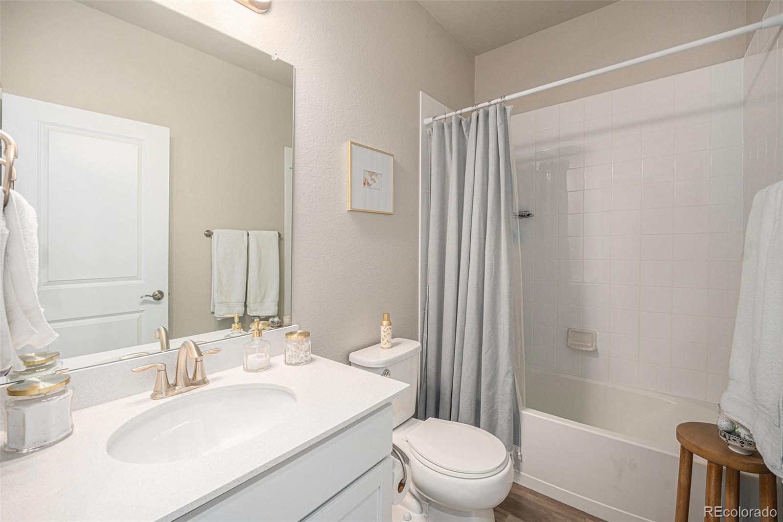 8430 Donati Terrace, Unit A Highlands Ranch, CO 80129 - Photo 17 of 26 a bathroom with a sink toilet and shower
