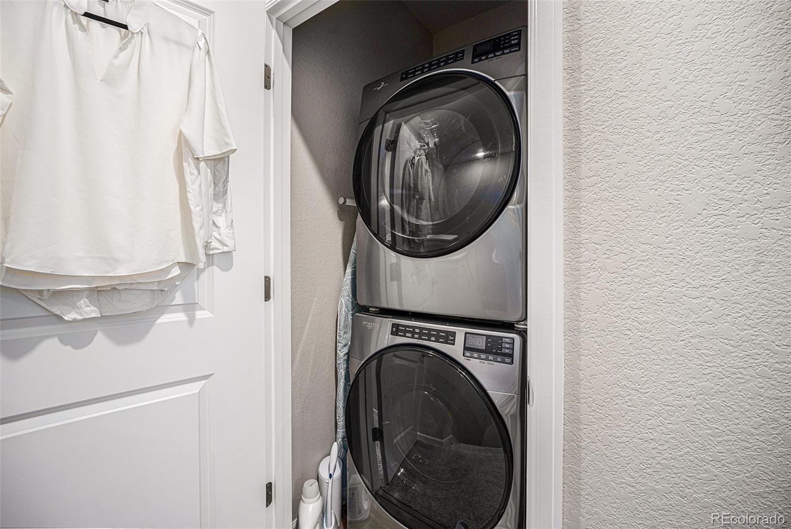 8430 Donati Terrace, Unit A Highlands Ranch, CO 80129 - Photo 19 of 26 a utility room with dryer and washer