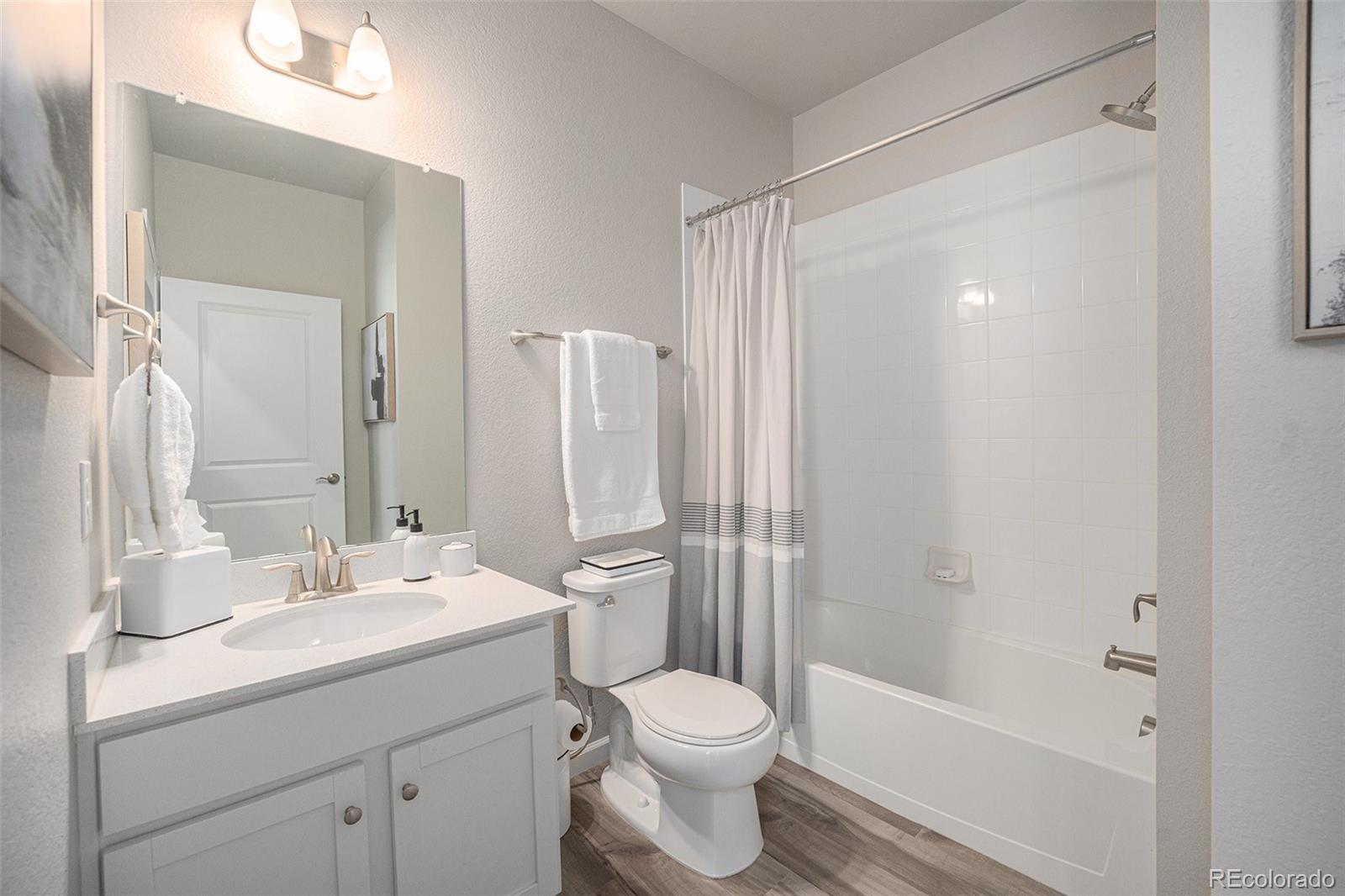 8430 Donati Terrace, Unit A Highlands Ranch, CO 80129 - Photo 21 of 26 a bathroom with a sink toilet and shower