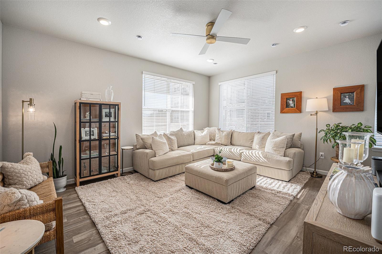 8430 Donati Terrace, Unit A Highlands Ranch, CO 80129 - Photo 9 of 26 a living room with furniture and a couch