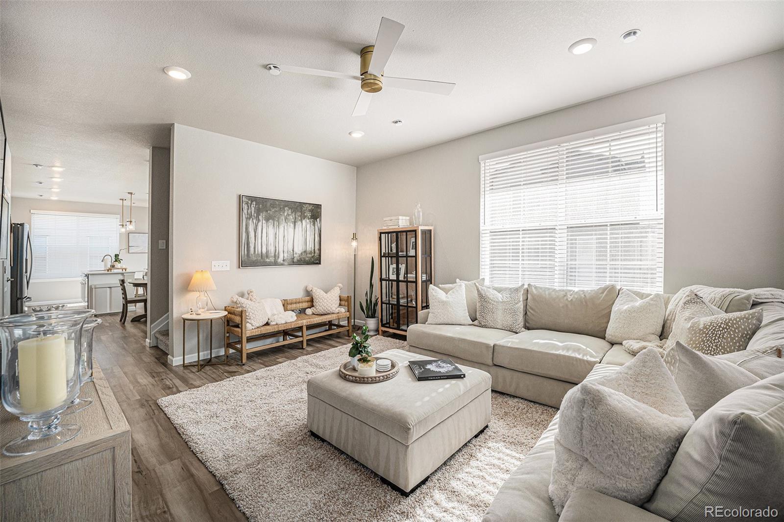 8430 Donati Terrace, Unit A Highlands Ranch, CO 80129 - Photo 10 of 26 a living room with furniture and a large window