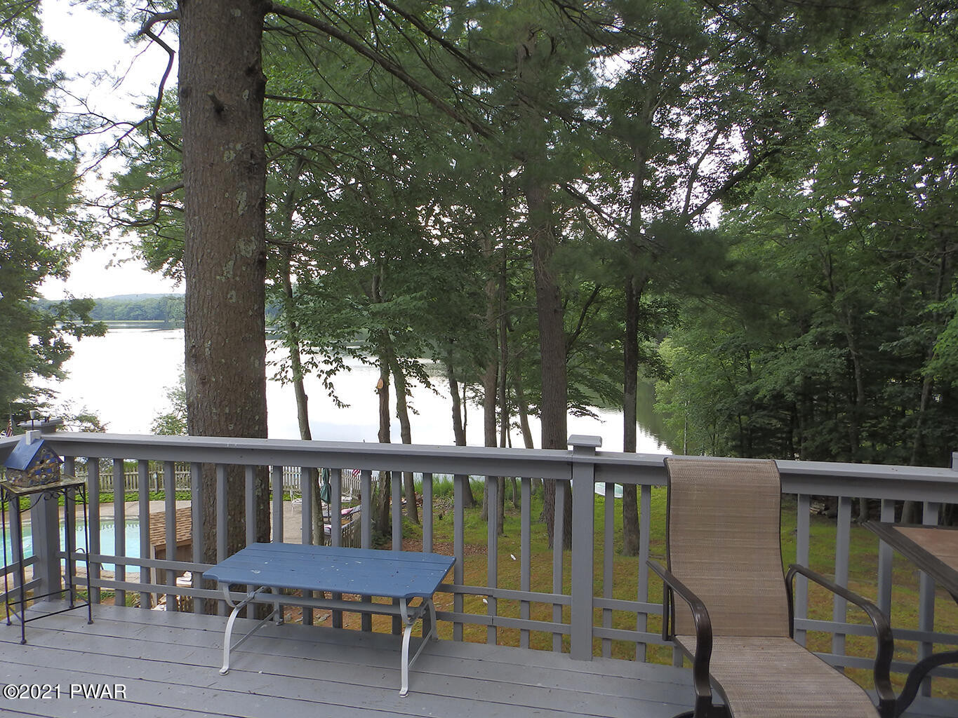 117 Crossing Road Dingmans Ferry, PA 18328 - Photo 23 of 32 a view of a wooden deck with a bench