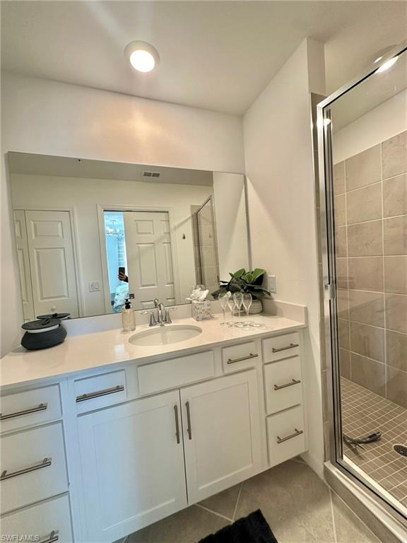 43989 Boardwalk Loop, Unit 2028 Babcock Ranch, FL 33982 - Photo 17 of 47 a bathroom with a sink and a mirror