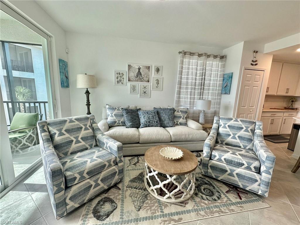 43989 Boardwalk Loop, Unit 2028 Babcock Ranch, FL 33982 - Photo 2 of 47 a living room with furniture and a large window