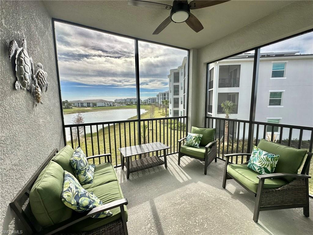 43989 Boardwalk Loop, Unit 2028 Babcock Ranch, FL 33982 - Photo 21 of 47 a living room with furniture and a large window