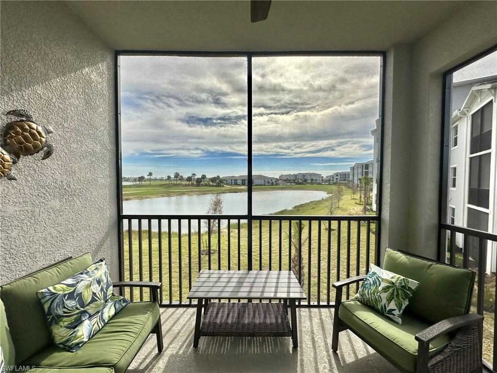 43989 Boardwalk Loop, Unit 2028 Babcock Ranch, FL 33982 - Photo 23 of 47 a balcony with furniture and a window