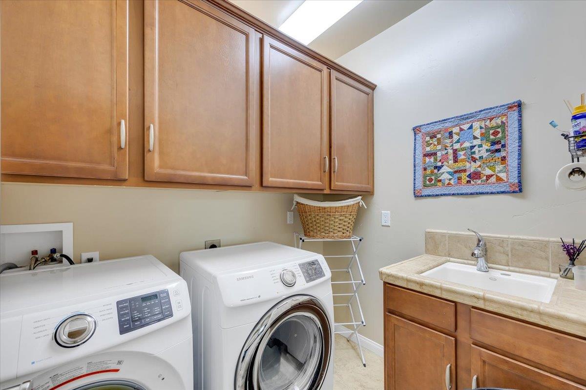 119 Hawkridge Court, Unit 460 Copperopolis, CA 95228 - Photo 56 of 71 Laundry Room with cabinets and sink.