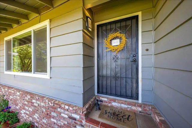 a kitchen view with stainless steel appliances kitchen island granite countertop a table and chairs in it