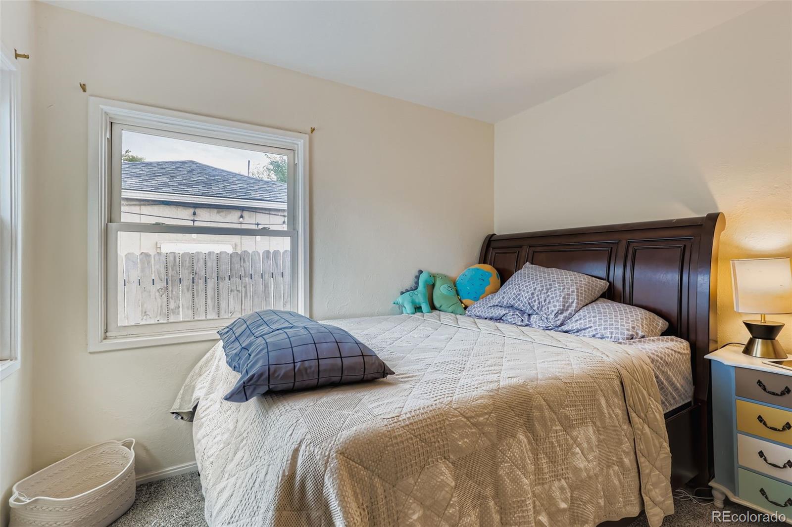452 Perry Street Denver, CO 80204 - Photo 17 of 29 a bedroom with a bed and window