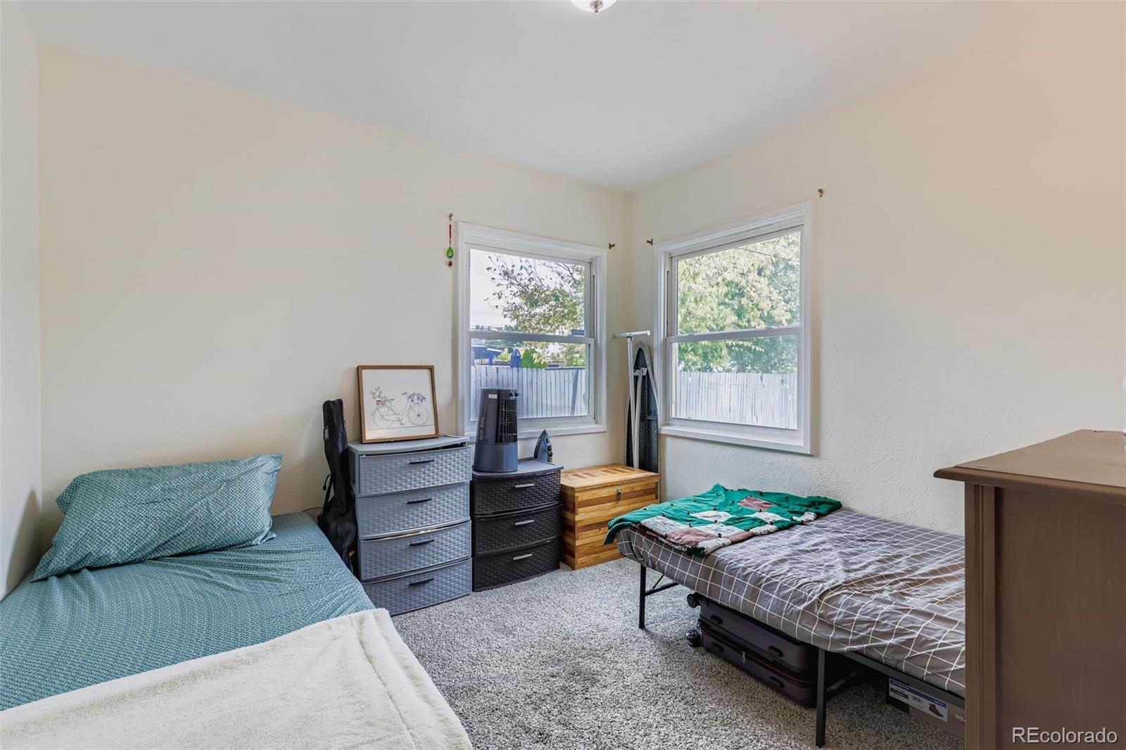 452 Perry Street Denver, CO 80204 - Photo 21 of 29 a bedroom with a bed and a window